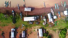 Fishing Village On The Edge Of The Tonle Sap.  Drone Birdseye Lift.