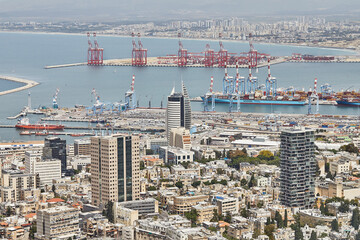 seaport in the city of haifa, panorama of the port and city buildings against the background of a bl