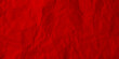 Red crumpled paper background. Vector texture of crumpled paper. Background paper. Textured wallpaper. Color red. Crumpled paper design