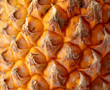 Orange peel of a ripe pineapple as an abstract background. Texture