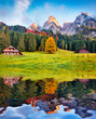 Huge Daeumling mountain range reflected in the calm waters of Gosau Lake. Amezing autumn scene of Austrian Alps, Gosau Valley, Austria, Europe. Beauty of countryside concept background..