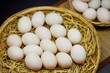 Close-up of white eggs in bamboo basket