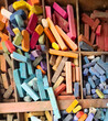 Colorful assortment of pastels in a wooden box