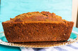 Textured zucchini bread on ornate silver platter, teal backdrop!
