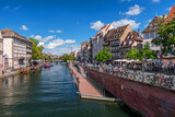 Fototapeta  - Le Petite France, the most picturesque district of old Strasbourg. Houses along the Ill river channel.