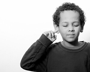 Wall Mural - little deaf boy covering his ears with people stock image stock photo