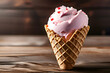 Heart Shaped Pink Ice Cream Perched Gracefully in a Wafer Cone on a Wooden Table
