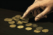 Man's hand counts coins illustration