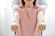 Female doctors rehab physical therapy by extending the pain hand of patient, treatment with stretch exercises