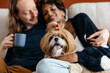 Cozy home scene with a pet dog and owners relaxing