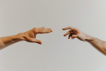 Moment of weightless. Two male hands trying to touch like a creation of Adam sign isolated on grey studio background. Concept of human relation, community, togetherness, symbolism, culture and history