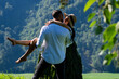 © Volodymyr - The sexy couple embraced passionately in the nature. Romantic kiss. Couple kiss on nature. Kissing couples. The romantic couple in love shared a kiss on the sun-kissed meadow.