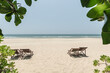 Beach chairs on the white sand beach