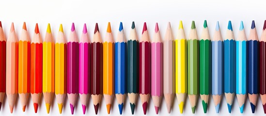 Copy space image featuring isolated crayons and pastels on a white background illustrating the concept of art in education