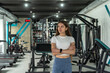 Portrait of sporty beautiful personal trainer for fitness training at gym center