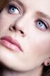 Closeup portrait of young female face. Woman with natural nude makeup