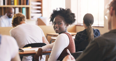 Poster - Teenager, girl and portrait in classroom for education lecture in high school or scholarship, notebook or students. Female person, face and desk for academic development or academy, smile or study