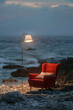floor lamp and armchair on the beach