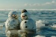 The impact of global warming depicted by two happy, melting snowmen by the ocean