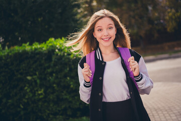 Poster - Photo of sweet pretty girl wear school uniform rucksack walking college outside urban city park