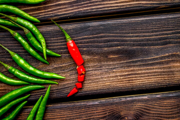 Canvas Print - Cooking hot food with chilli pepper on wooden table background top view copy space