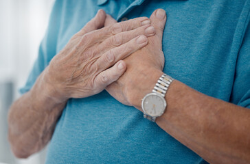 Senior man, heartburn and hands for heart attack, home and stress on lungs or anxiety emergency. Elderly male person, pain and cardiovascular stroke or asthma, cardiac arrest and disease in closeup