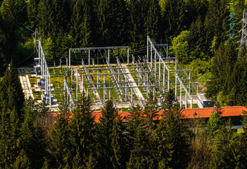 electric current transformer station. Aerial photo of an electricity industrial station to convert the powerful electric network to the one used by a city.