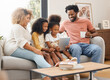 Kids, parents and tablet for education, gaming or streaming on sofa of living room in home together. Coffee, tech and black family with girl children in apartment for homework, research or study