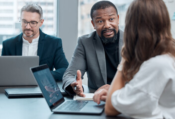 Black man, manager and mentor with laptop for instruction in office for meeting, strategy and discussion in workplace. Business people, coaching and computer on desk for planning, support and guiding