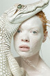 Charismatic albino girl with red hair and a white crocodile