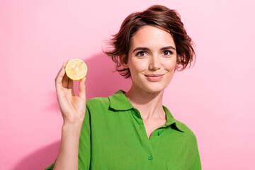 Sticker - Photo portrait of pretty young girl hold half lemon fruit wear trendy green outfit isolated on pink color background