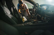 Car Owner Vacuuming His Vehicle Interior