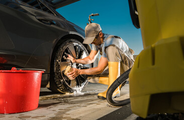 Wall Mural - Caucasian Man Washing His Car