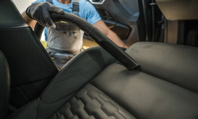 Wall Mural - Car Owner Vacuuming His Vehicle Interior