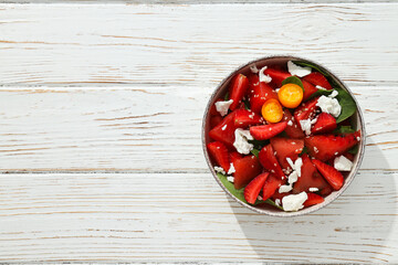 Wall Mural - Fresh watermelon salad in a bowl on a white background