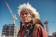 Native American man with feathered headdress against blue sky