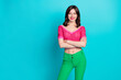 Portrait of satisfied nice girl with silky hairstyle wear pink top hold arms crossed near empty space isolated on blue color background