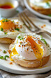 Poached eggs on toasted English muffin close up