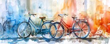 Two Watercolor Bicycles Are Parked Side By Side Against A Blurred Background Of Color. The Blue Bicycle Is On The Left And The Red Bicycle Is On The Right.