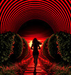 A woman is running through a tunnel with red and black stripes