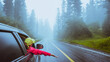 Asian women travel relax in the holiday. driving a car traveling happily. Amid the mist  rainy.