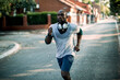 © Geber86 - Active young black man jogging on the street