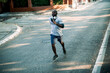 © Geber86 - Active young black man jogging on the street