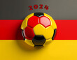 A soccer ball on a banner in the German national colors