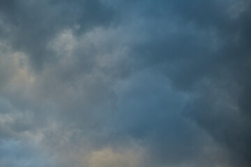 A close-up of a storm cloud, overcast sky, dramatic sky before the rain, shades of light in the storm cloud, close-up