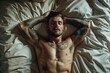 Relaxed Tattooed Man Lying on Bed with Closed Eyes in Sunlit Room
