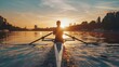 © Prostock-studio - A man rows a boat across a tranquil lake, surrounded by nature.