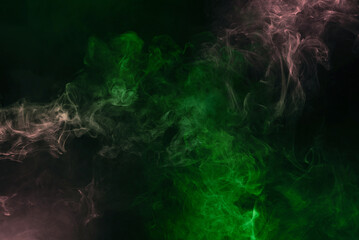 Wall Mural - Green and pink steam on a black background.