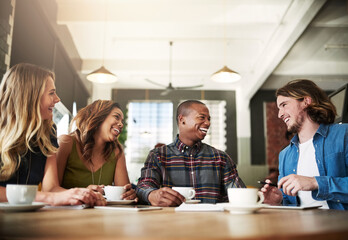 Wall Mural - Funny, group and friends drinking coffee in shop for conversation, talking or social gathering together in restaurant. Happy people, students and relax in cafe for chat, news or laugh at gossip story