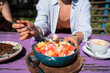 Fruit bowl with papaya, watermelon, melon with natural yogurt and granola. Vegetarian food.